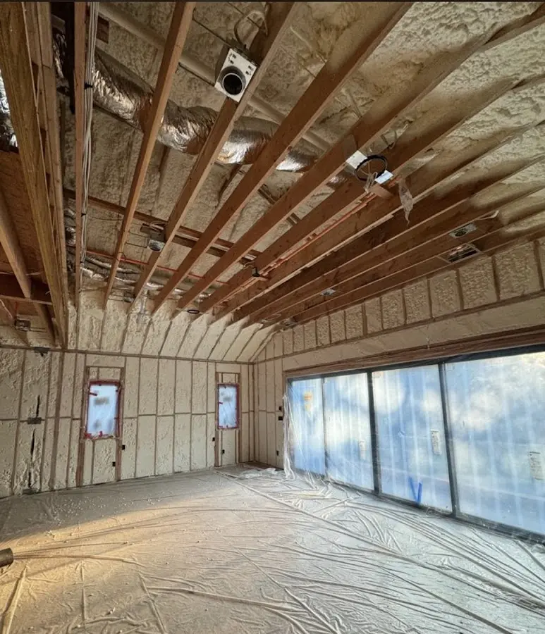 Interior walls and ceiling insulated with spray foam during new construction in Tempe